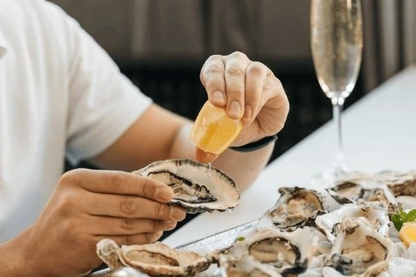squeezing lemon on food